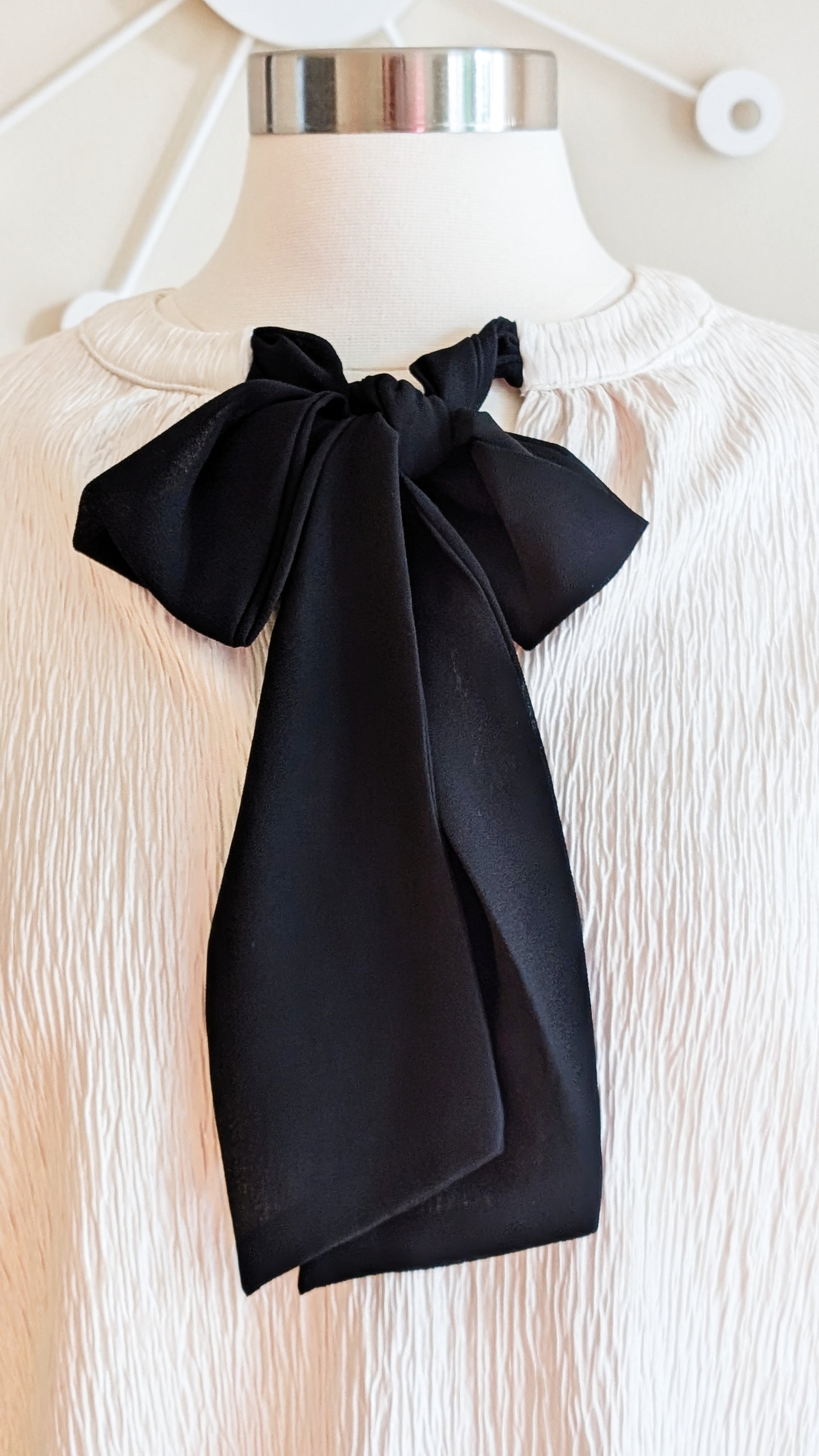 ivory blouse with black bow