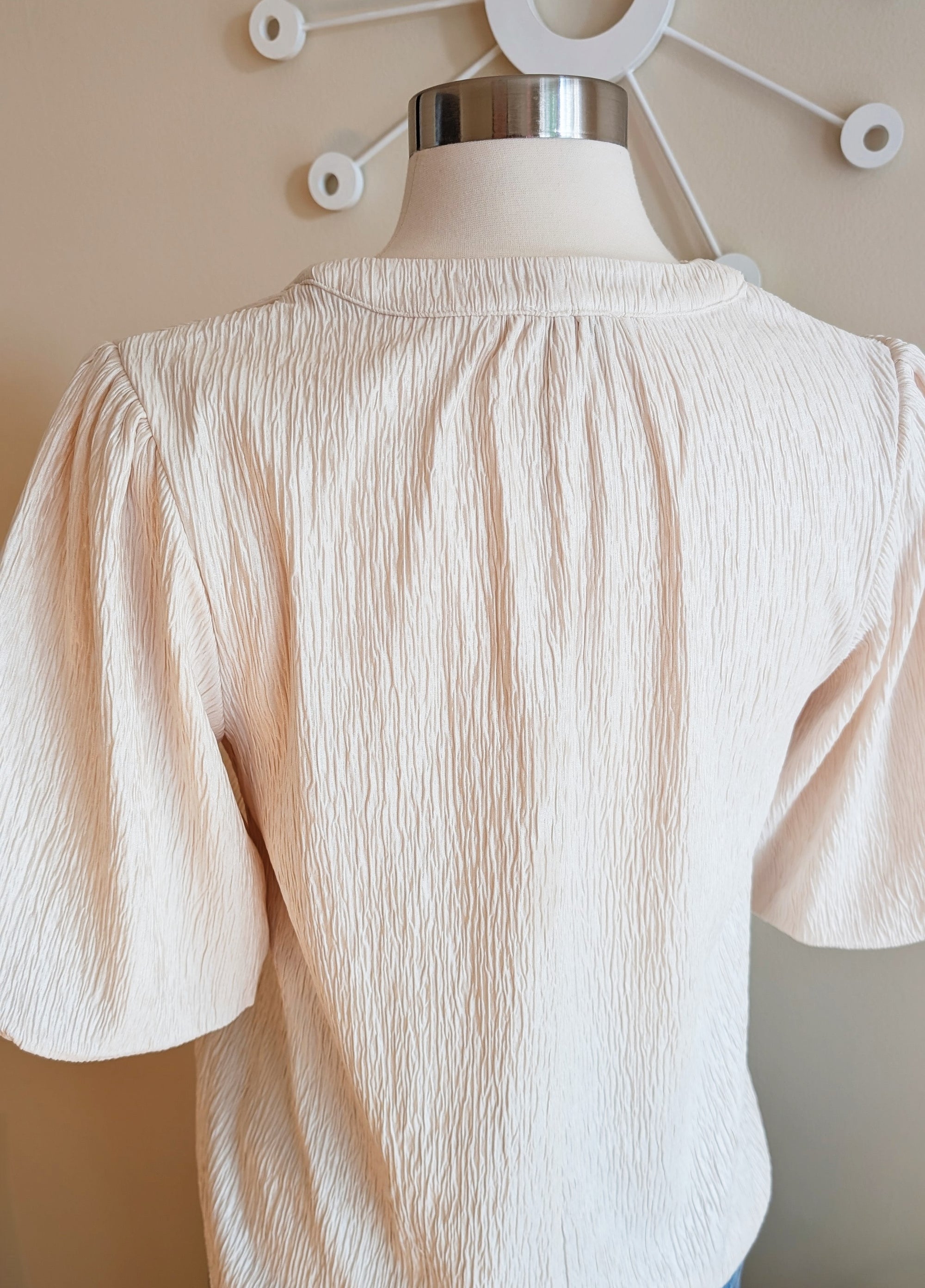 ivory blouse with black bow