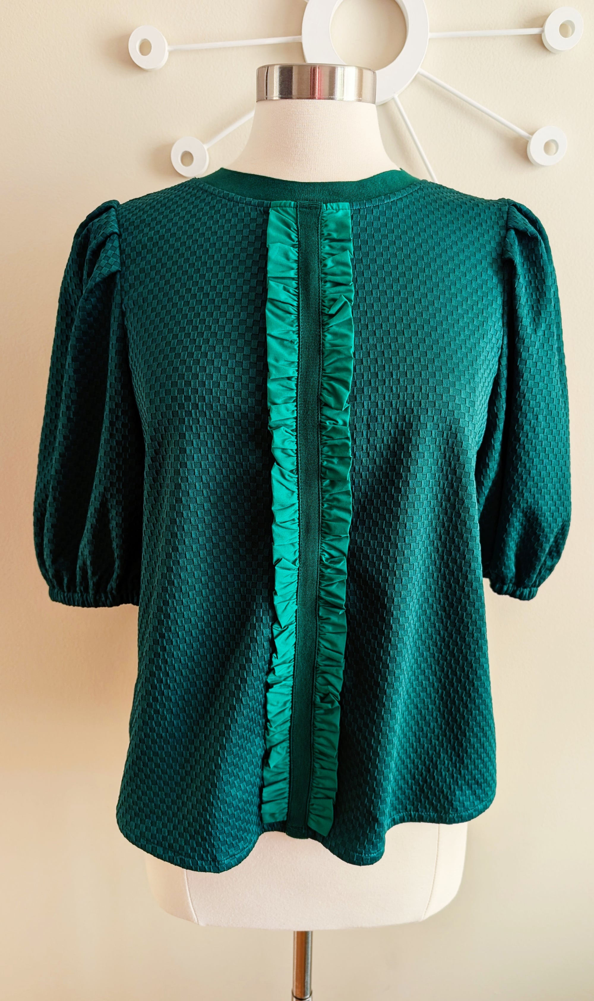 green textured top with ribbon detail