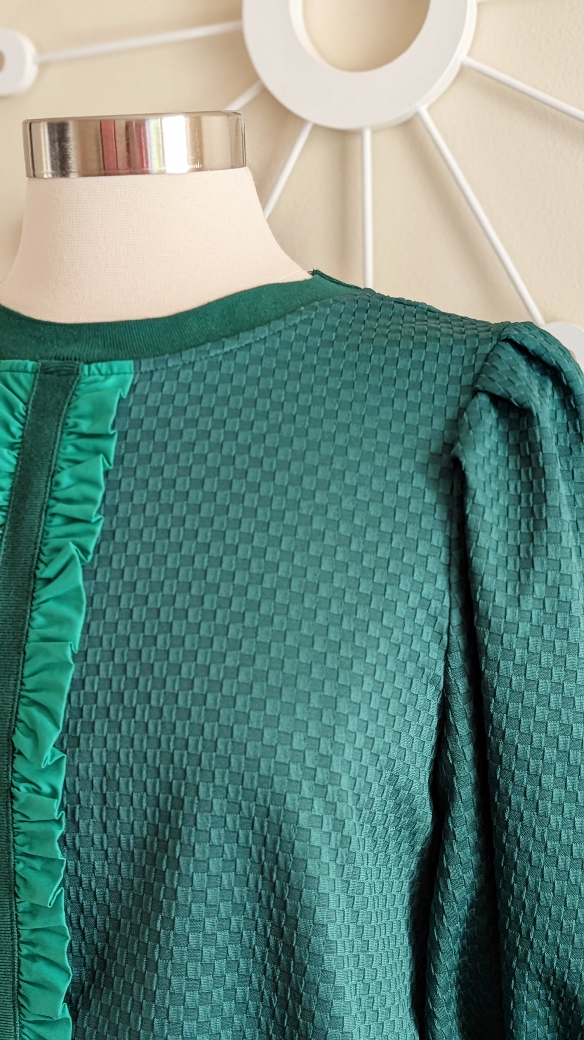 green textured top with ribbon detail