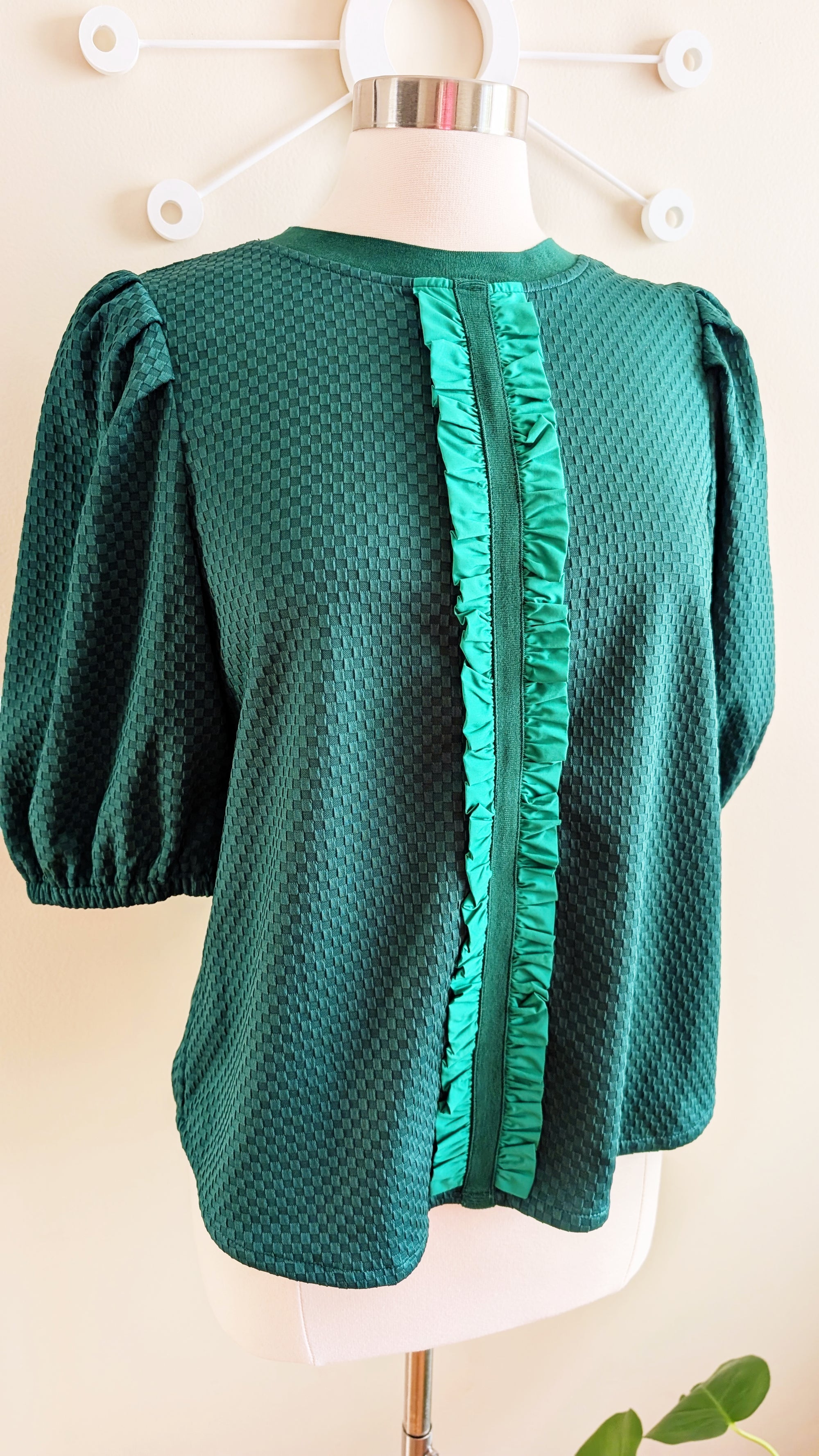 green textured top with ribbon detail