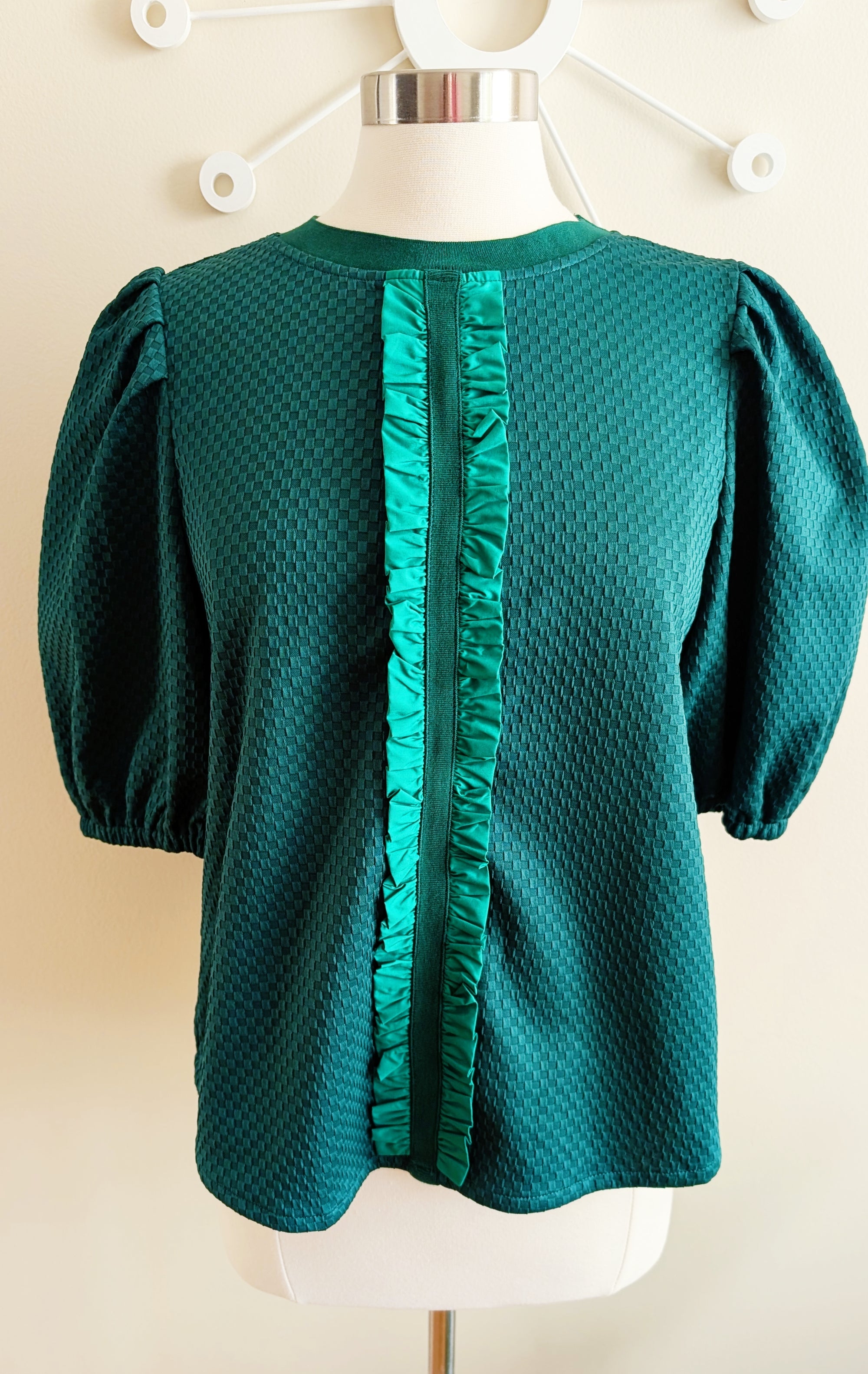 green textured top with ribbon detail